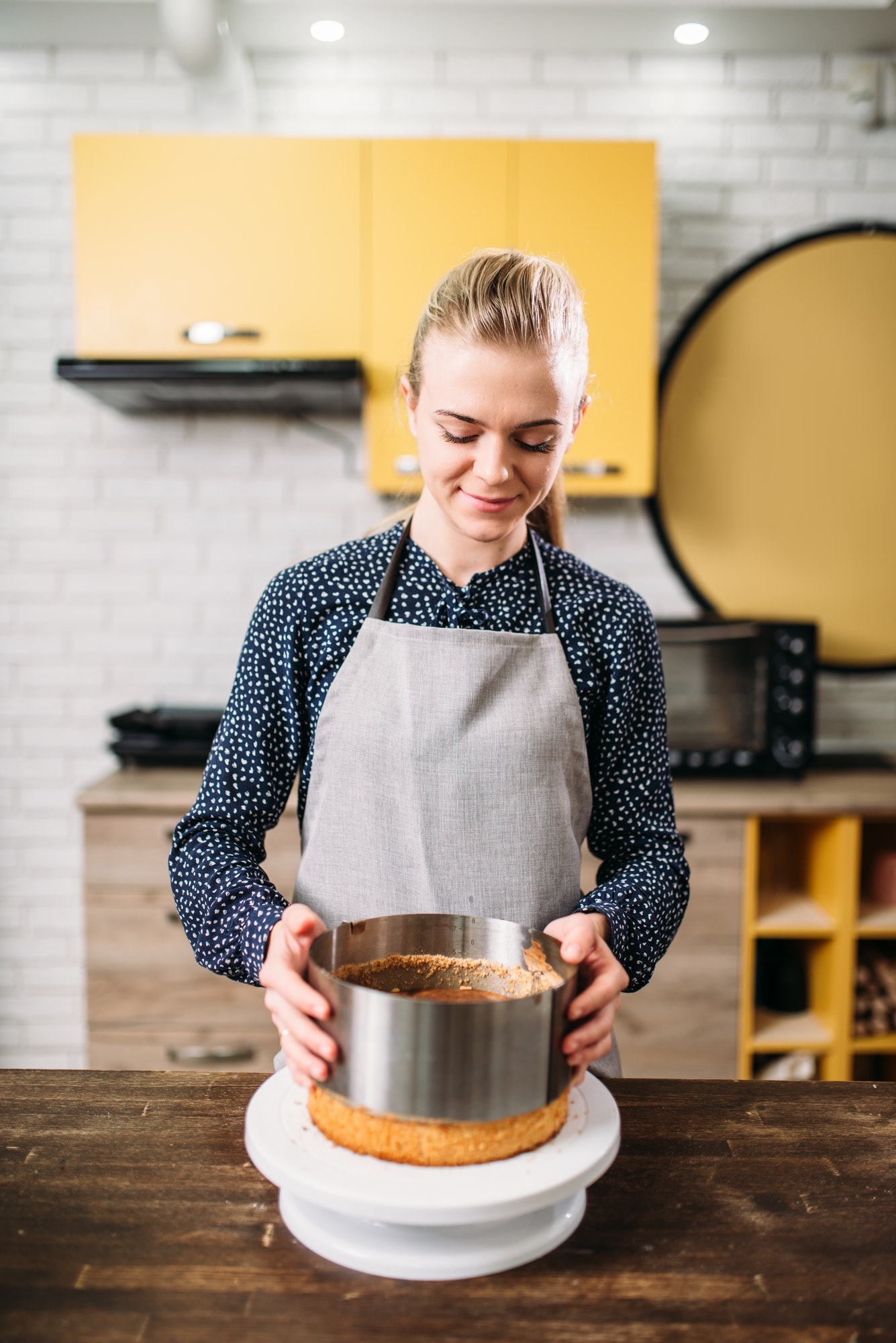 woman-cook-in-apron-takes-the-form-of-a-baked-cake.jpg